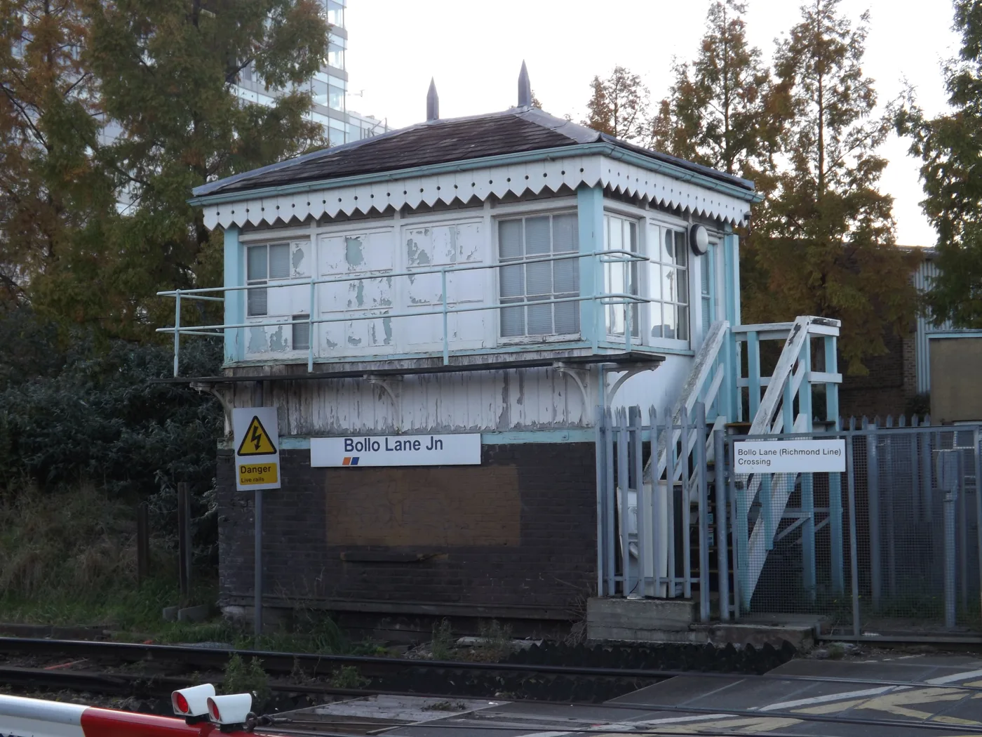 The Bollo Lane Junction signal box and the Richmond line crossing in South Acton, a few hundred metres over the boundary from Chiswick. Photographed in October 2014.